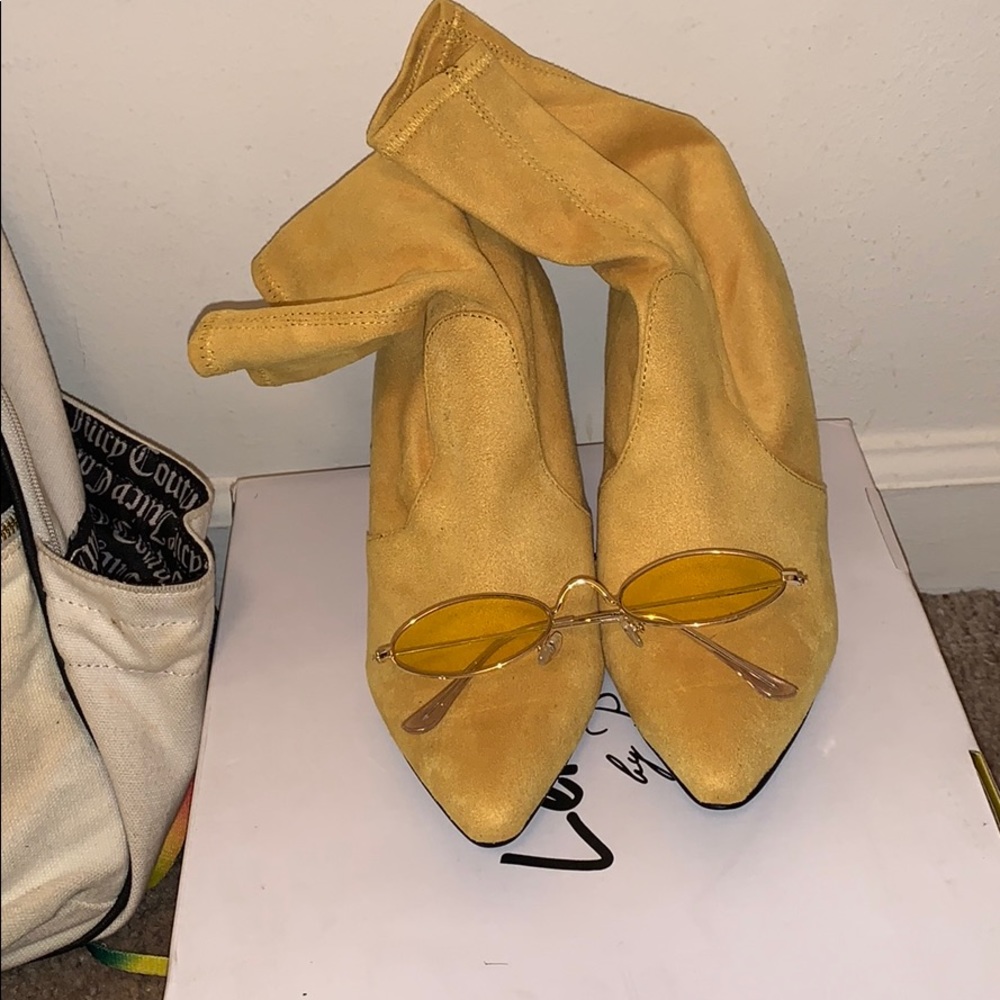 Heeled boots and sun glasses
